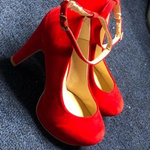 Red high heeled pumps with strap